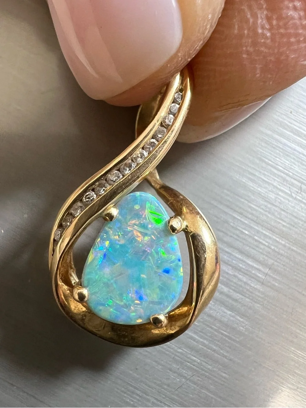 14K yellow gold pendant with genuine diamonds and an opal doublet
